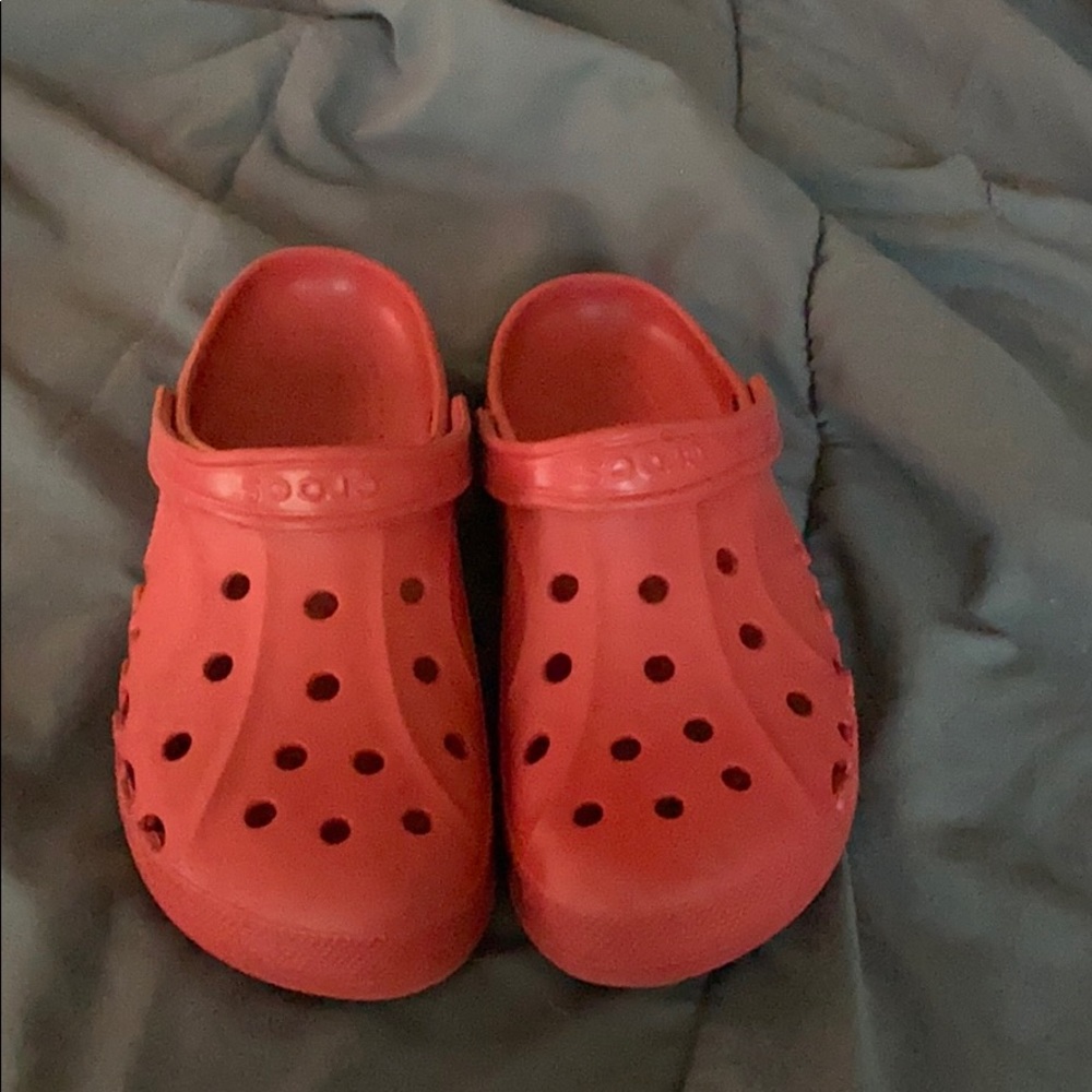 Red pair of crocs